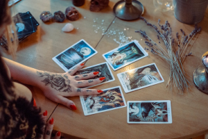 A person reads tarot cards.