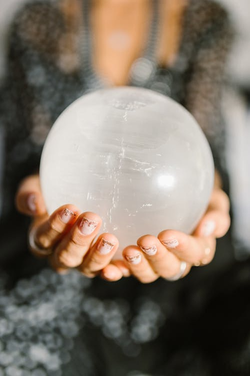 A person holds a psychic ball.