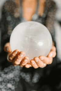 A person holds a psychic ball.